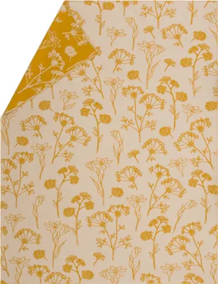 A close-up view of a blanket with a floral pattern.