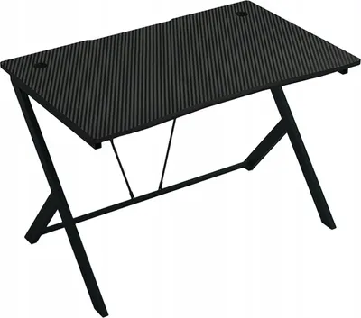A black gaming desk with a carbon fiber texture and black metal legs, shown from a slightly elevated angle against a white background.