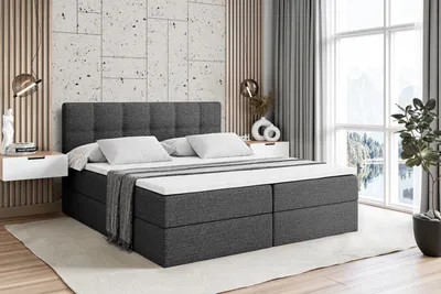 A bedroom scene with a bed, nightstands, and a window with a view.