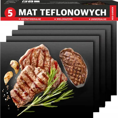 A stack of black grill mats with grilled steaks, garlic, and rosemary on top.