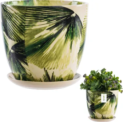 A ceramic pot with a green leaf pattern and a matching saucer, shown with a small plant in a separate, smaller pot.