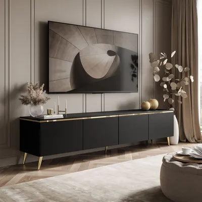 A modern living room with a TV stand and a large television mounted on the wall.