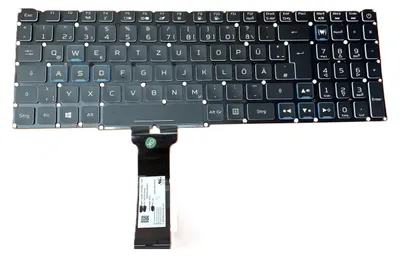 A laptop keyboard with a ribbon cable attached, isolated on a white background.