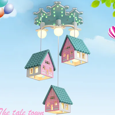 A whimsical ceiling light designed to look like a row of colorful houses, suspended against a bright blue sky with cartoonish clouds and balloons.