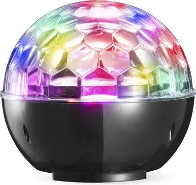 A colorful disco ball light sits on a black base.