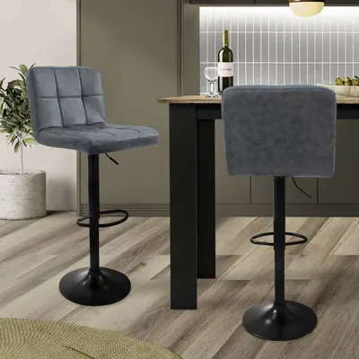 Two gray bar stools are shown in a kitchen setting.
