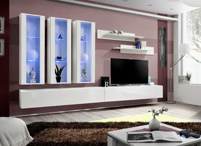 A modern living room with a wall-mounted entertainment unit, TV, and display cabinets.