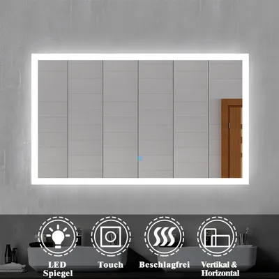 A lit LED mirror in a bathroom setting, with icons below describing its features.