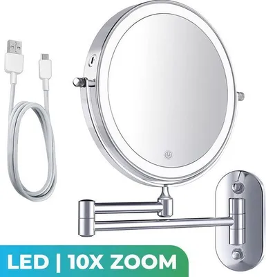 A wall-mounted makeup mirror with LED lighting and a USB charging cable.