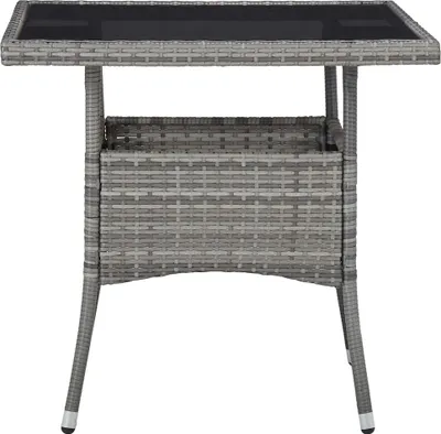 A gray poly rattan garden dining table with a glass top, shown from the front against a white background.