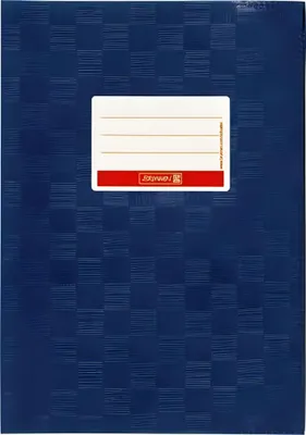 A close-up of a blue notebook cover with a label for writing information.