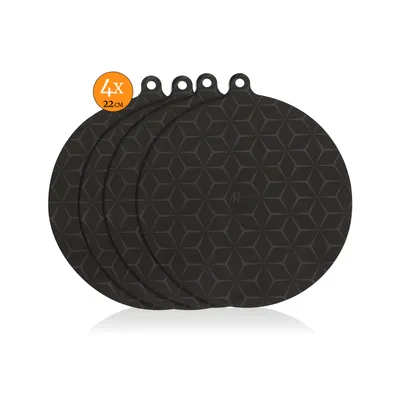 A set of four black silicone induction hob covers with a geometric pattern.