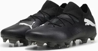 A pair of black Puma soccer cleats.