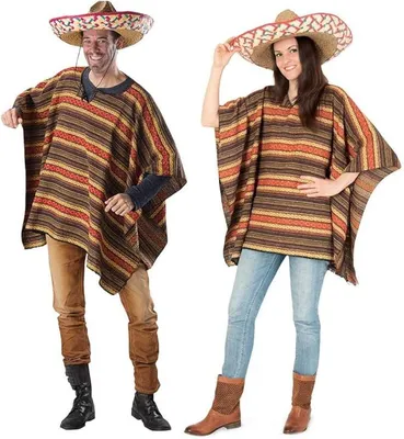 A man and a woman are posing in traditional Mexican ponchos and sombreros against a white background.