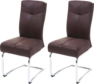 Two brown dining chairs with chrome legs on a white background.