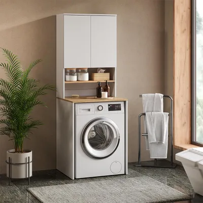 A laundry room scene with a washing machine and a cabinet above it.