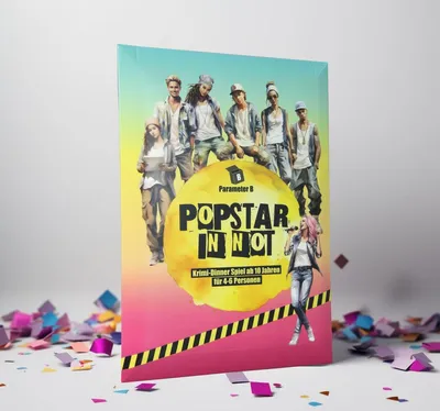 A product box for a board game is displayed on a white surface with confetti scattered around it.