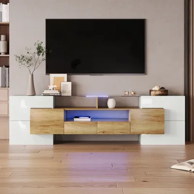 A modern TV stand with LED lighting in a living room setting.