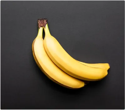 Produktbild von Spritzschutz Herdabdeckplatte Schneidebrett aus Glas Bananen 1-Teilig (60x52cm)