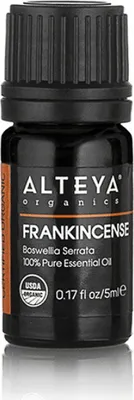 A product shot of a small bottle of essential oil.