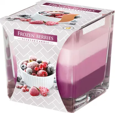 A scented candle in a glass jar with a label showing frozen berries and the product name.
