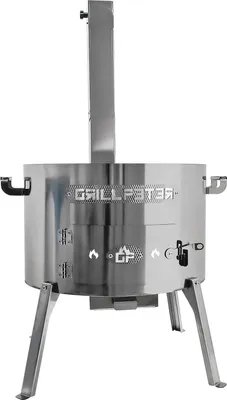 A stainless steel outdoor oven with a chimney.