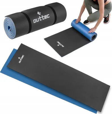 A person is unrolling a blue yoga mat on top of a black mat.