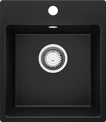 A black granite kitchen sink with a silver drain.