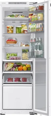 An open refrigerator with food items on its shelves.