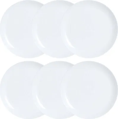 A set of six white plates arranged in two rows of three.