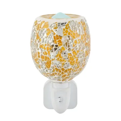 A mosaic glass electric aroma lamp plugged into a wall socket.