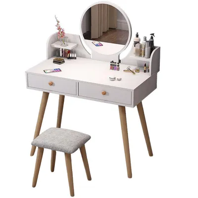 A white vanity table with a round mirror and a stool, set against a white background.