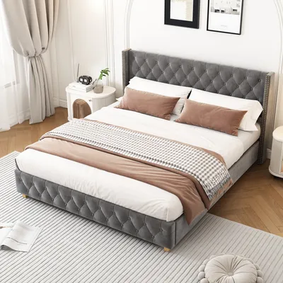 A bedroom scene with a bed as the main focus.