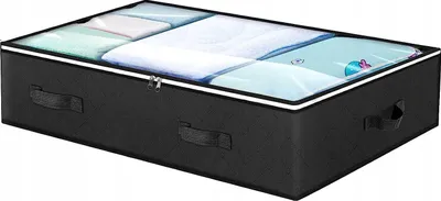 A black fabric storage box with a clear lid, filled with folded linens, is shown from a slightly elevated side angle.