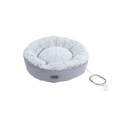 A grey, round pet bed with a fluffy white interior and a power cord attached.