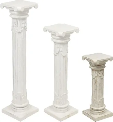 Three white decorative columns of varying heights are displayed against a white background.
