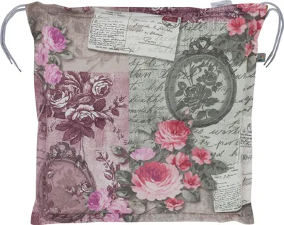 A square cushion with a floral and postcard-like print.