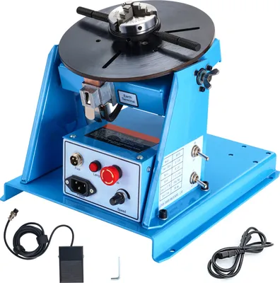 A blue welding positioner with a black turntable and chuck is shown on a white background.