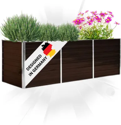 A rectangular planter box filled with green plants and pink flowers, with a diagonal white banner featuring the German flag and text.