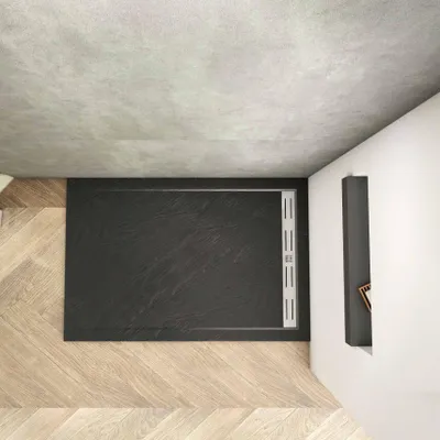A top-down view of a modern bathroom with a black rectangular shower tray on a wooden floor.