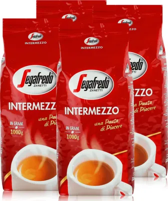 Four bags of Segafredo Intermezzo coffee beans are displayed in front of a white background, with cups of espresso shown at the bottom of the bags.
