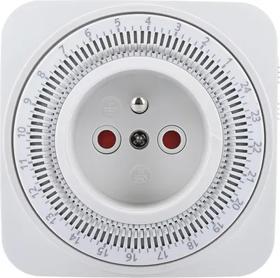 A close-up, front-facing view of a white electrical timer outlet with a circular dial and numerical markings.