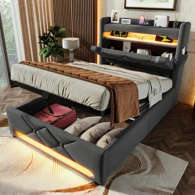 A modern bedroom with a bed featuring a storage headboard and under-bed storage.