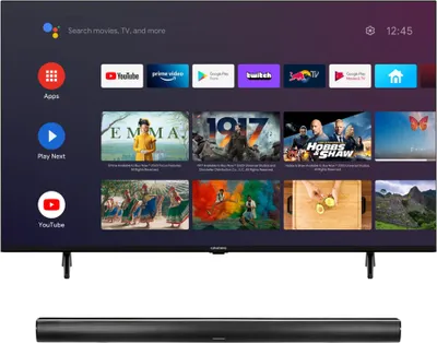 A television screen displaying a smart TV interface with various apps and content previews, placed above a soundbar.