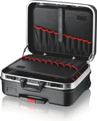An open black tool case with silver trim, showing its interior compartments and tool holders.
