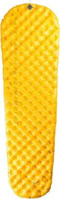 A yellow sleeping mat is shown from above, laid out flat against a white background.