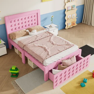 A child's bedroom with a pink bed, toys, and a bookshelf.