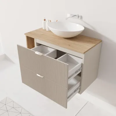A bathroom vanity with a sink and open drawers.