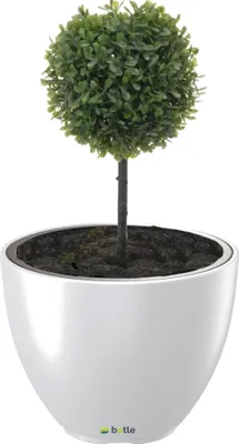 A white planter with a green artificial topiary plant inside, set against a white background.