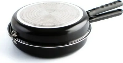 The image shows the underside of a black double-sided pan with a silver heating element.